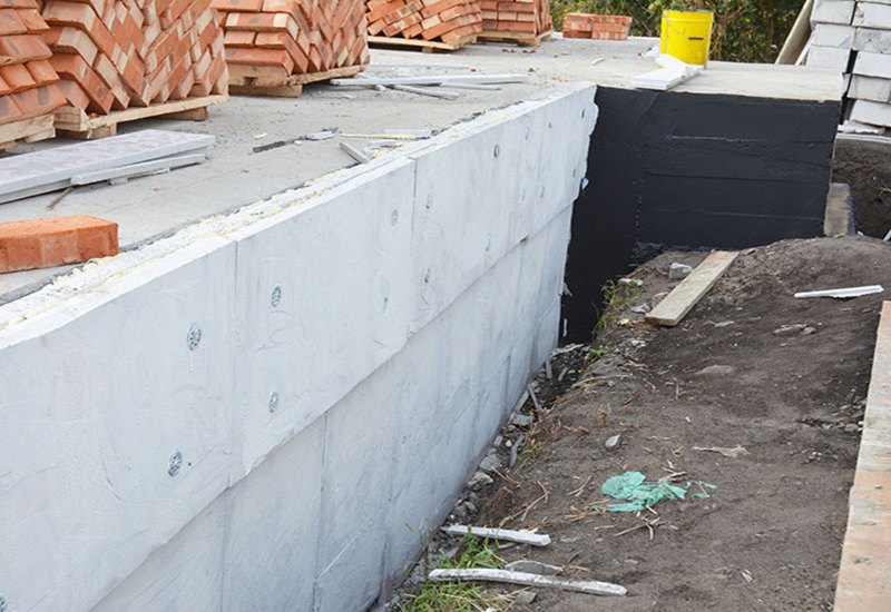 Coating Is Applied to the Foundation of a Home to Provide Basement Waterproofing in Maryland